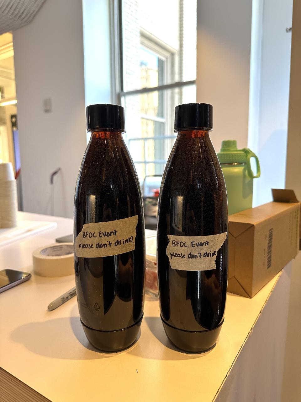 two soda stream bottles full of diet coke