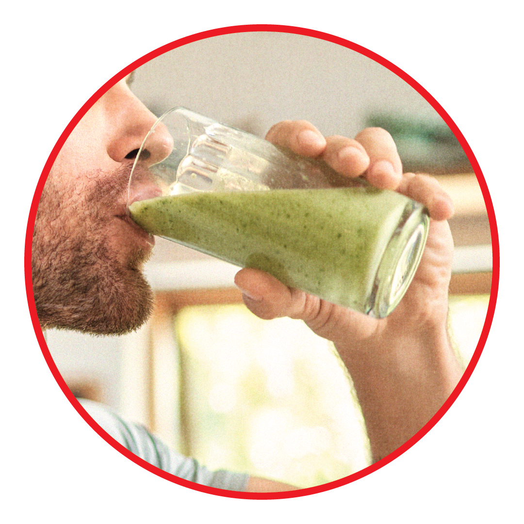 man drinking green smoothie