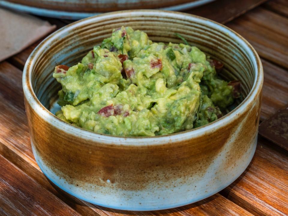 bowl of fresh guacamole on a table