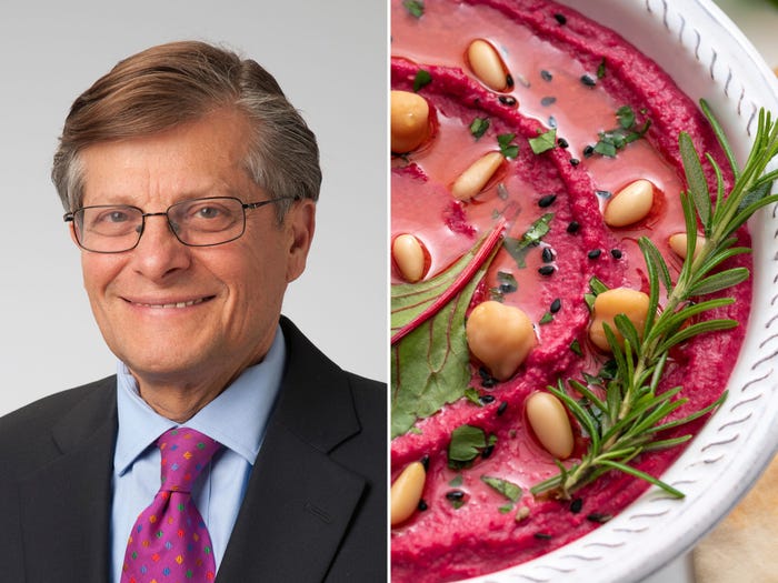 Dr. Michael Rozien alongside a plate of beet hummus.