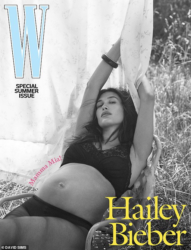 She proudly displayed her baby bump on the cover of latest issue of W, modeling a set of dark lingerie as she lounged on a patio chair