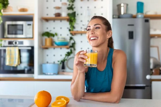 Woman drinking orange juice