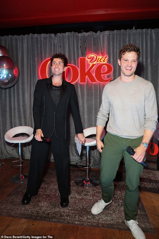 Jamie kept it casual for Thursday's event as he opted for a simple grey jumper and khaki trousers, while Nick wore a stylish black blazer with white stitched detailing