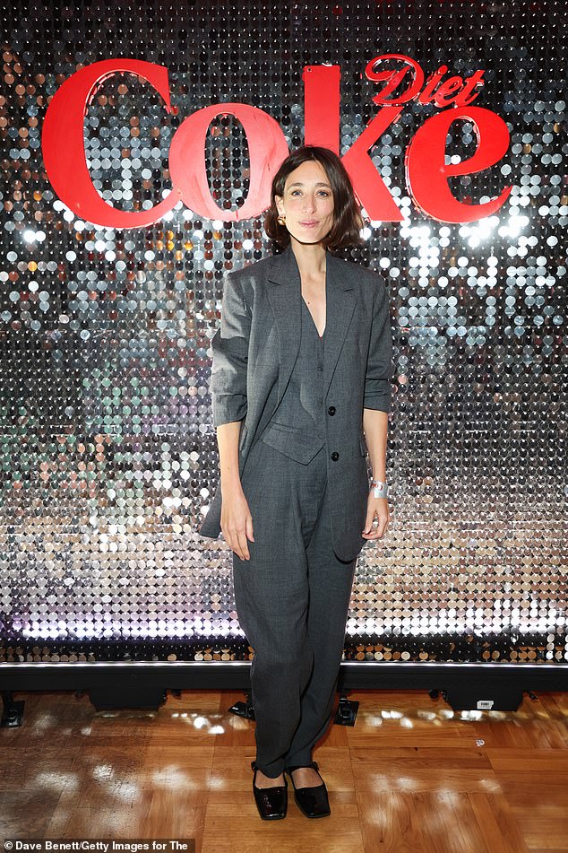 Laura Jackson looked smart in a grey three-piece suit and square-toe shoes