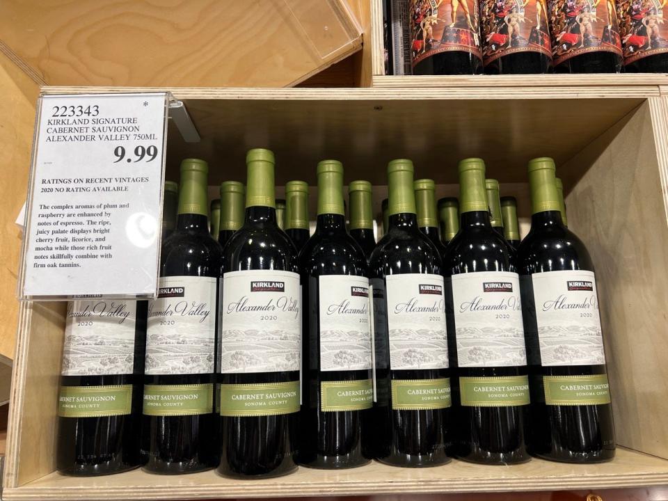 Bottles of Kirkland red wine in wood box display