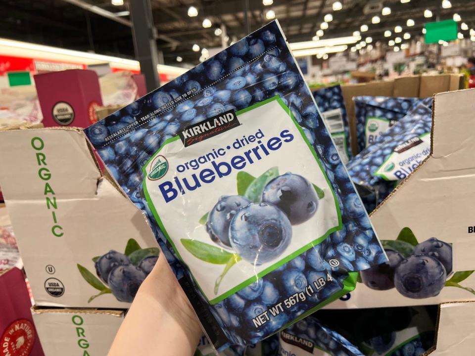 Kirkland dried blueberries bag in front of Costco dried blueberry display