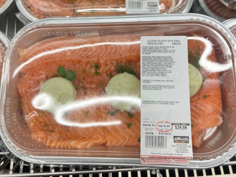 Salmon with garlic butter in clear container at Costco