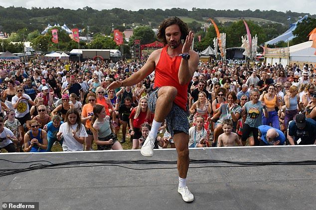 In a fresh interview, Wicks, 39, who rose to prominence with his PE with Joe workout videos during Covid lockdowns, has said he wasn't 'saying that ADHD is caused by poor diet'. Pictured, Wicks at Glastonbury Festival earlier this year