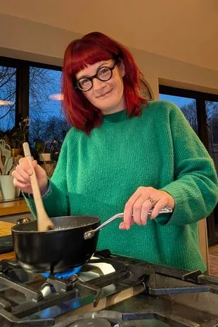 A picture of Claire Spreadbury cooking a meal from scratch as she tries to ditch UPFs from her diet for two weeks