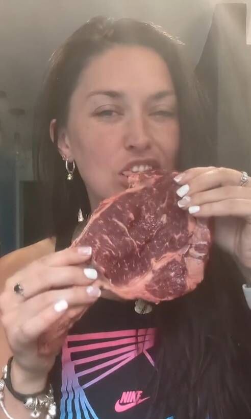 Rachel eating raw meat