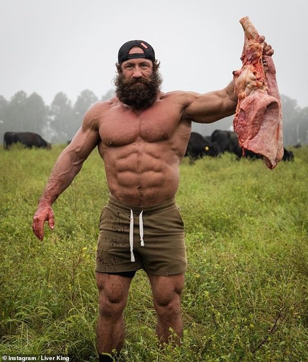 Social media is awash with accounts hyping the carnivore diet, which sees proponents mainly or only consume animal-based foods like steak, eggs and butter. Pictured Brian Johnson, better known as the Liver King, who has built a following from his raw carnivore diet, mainly filled with meat